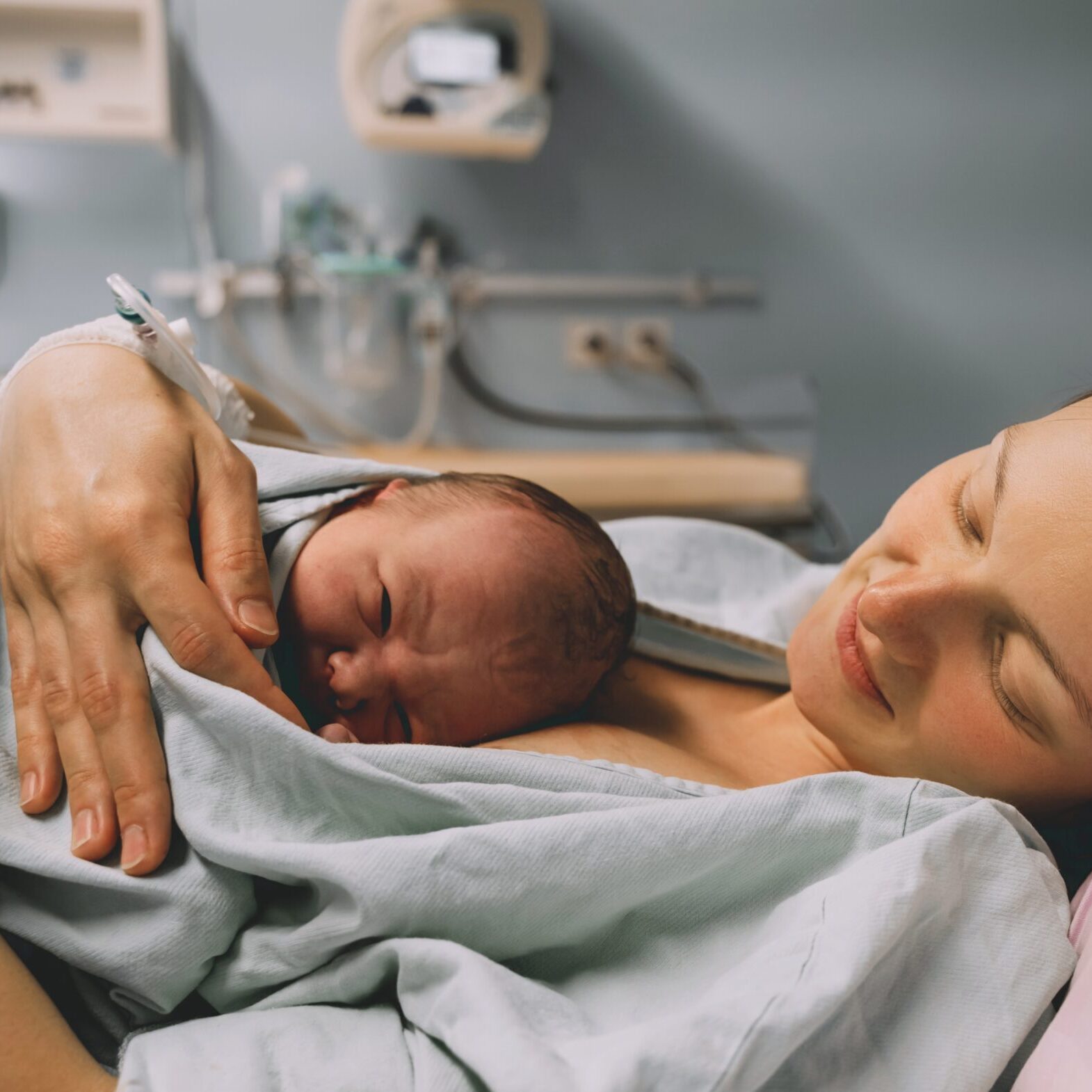 Mother,And,Newborn.,Child,Birth,In,Maternity,Hospital.,Young,Mom